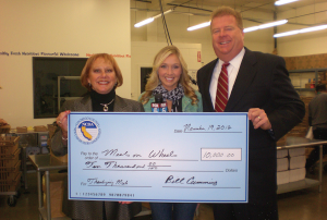 NCDA board member presenting a check to a charity.